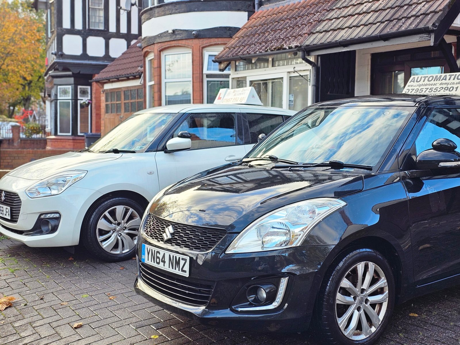 Driving instructor teaching road awareness in a Suzuki Swift